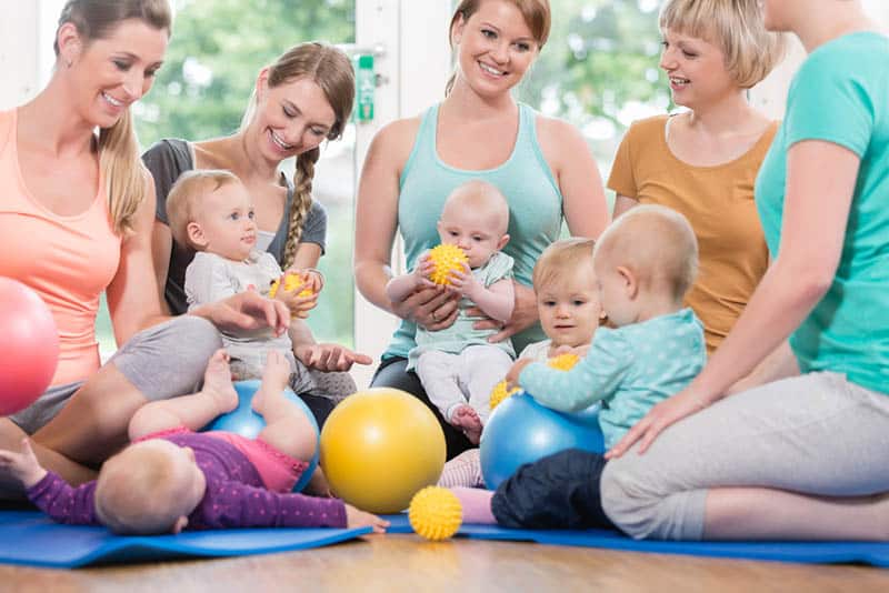 group of women at parenting class with babies