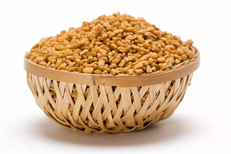 Fenugreek seeds in wooden basket