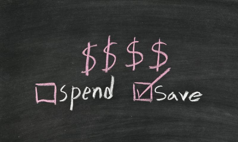 save money not spend written on blackboard