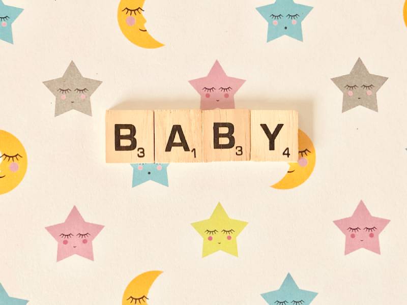 Baby with scrabble titles