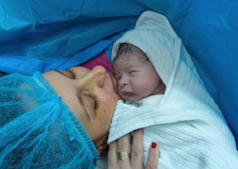 Newborn baby with mother in hospital