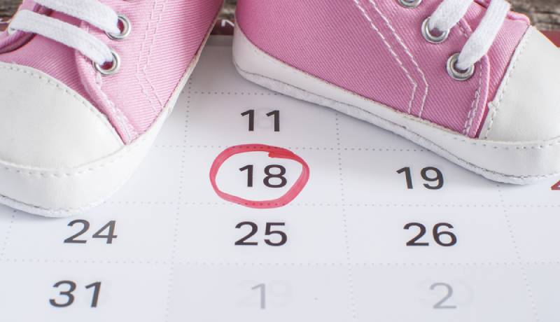 Selected due date in the calendar and detail of baby shoes