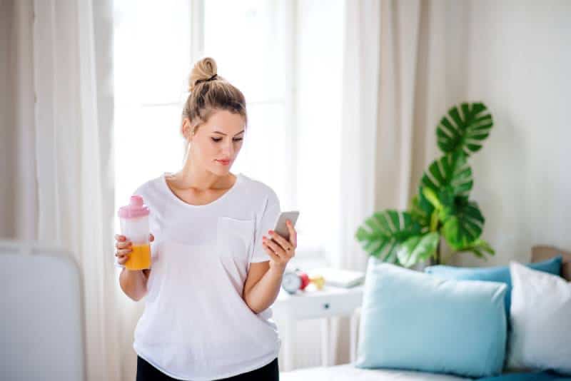 Young woman doing exercise indoors at home