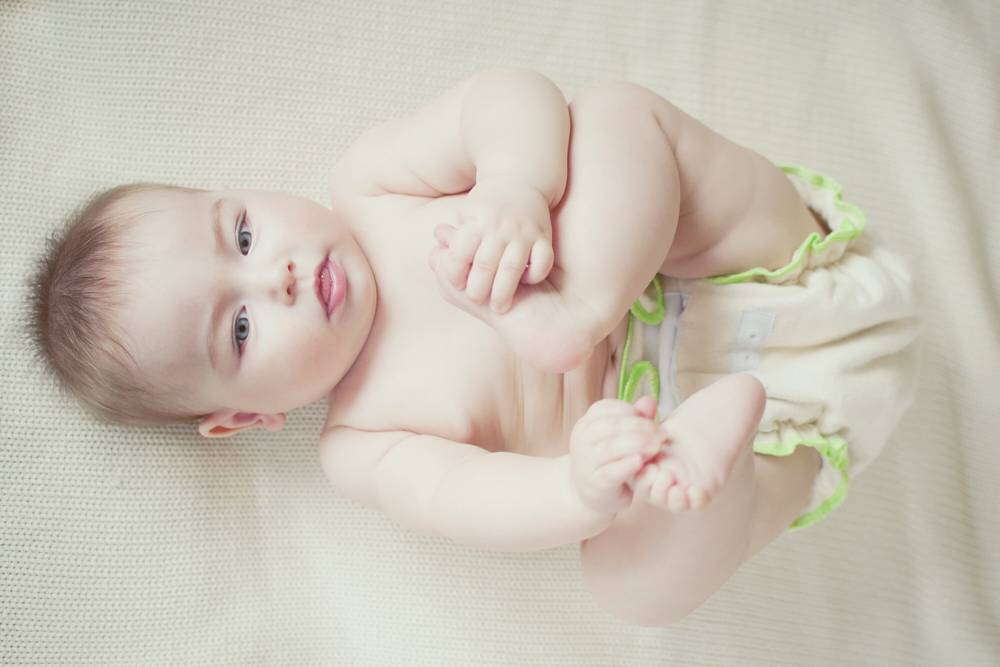 baby in eco-friendly cotton diapers