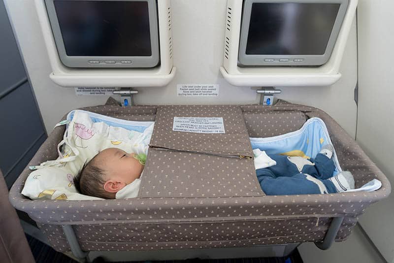 baby in special bassinet portable while travel 