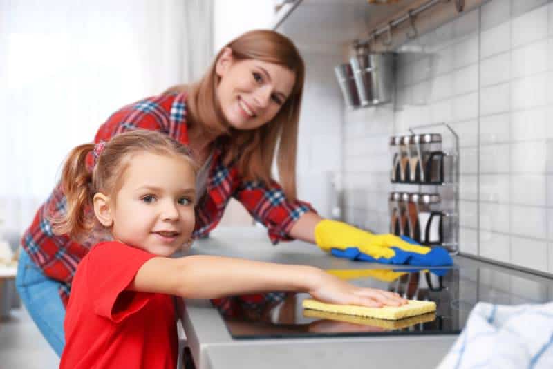 Little girl and her mother doing cleanup 