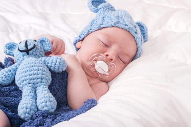 Sleeping baby boy with pacifier