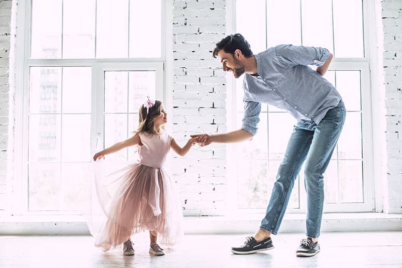 father and daughter dancing