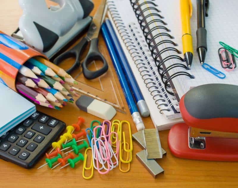 free office supplies on wooden table