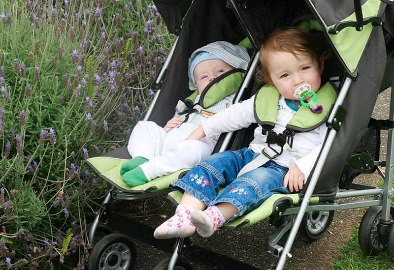 babies in green double stroller