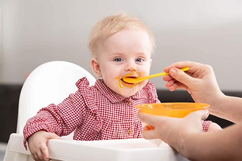 baby eating with self feeding spoon