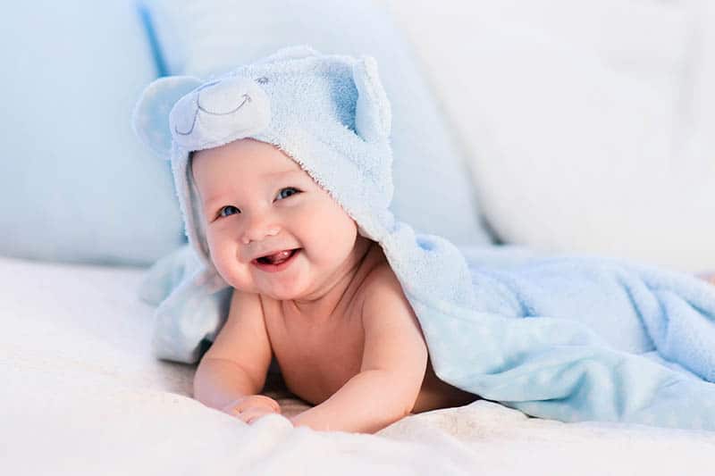 cute baby smile in blue towel