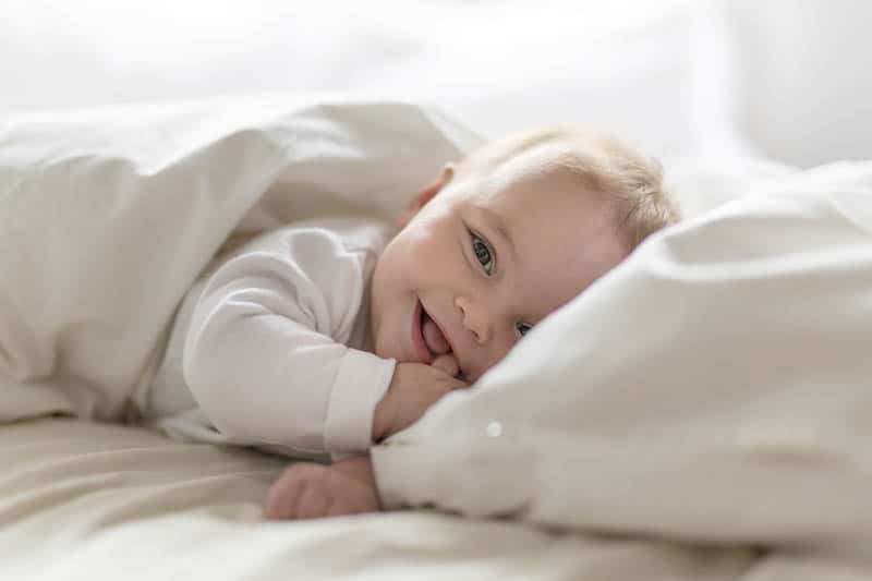 baby laughter in bed 