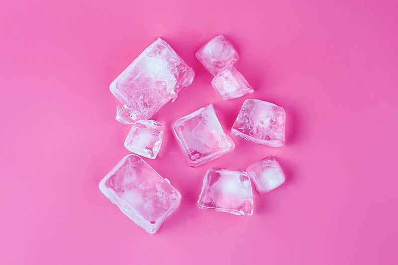 ice cubes with pink background 