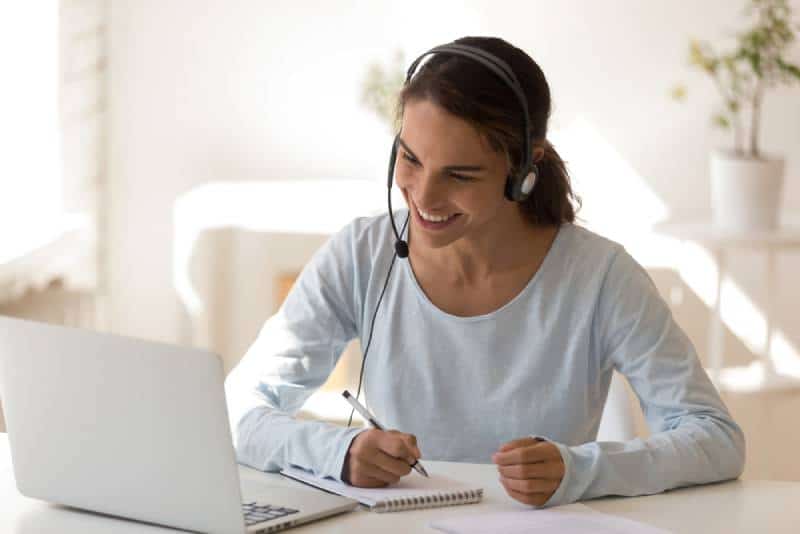 woman wearing headset and working from home