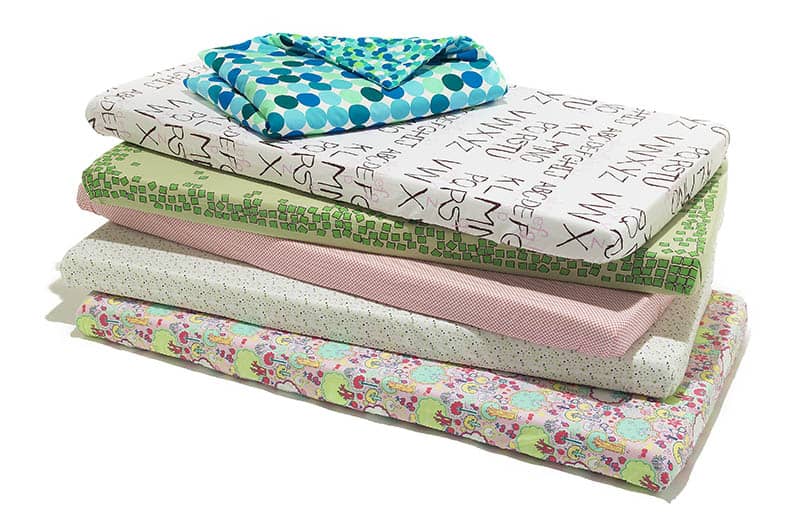 crib sheets isolated stacked 