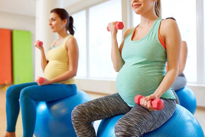 Pregnant women doing workout in a group 