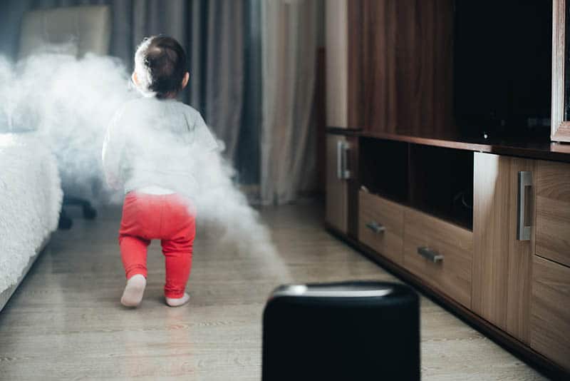 baby walking away from humidifier