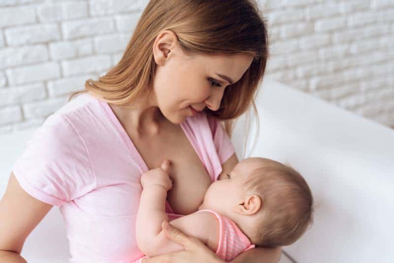 Young mom breastfeeding her baby