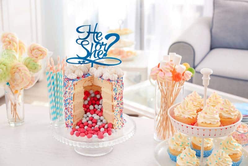 Tasty treats served for baby gender reveal party on table