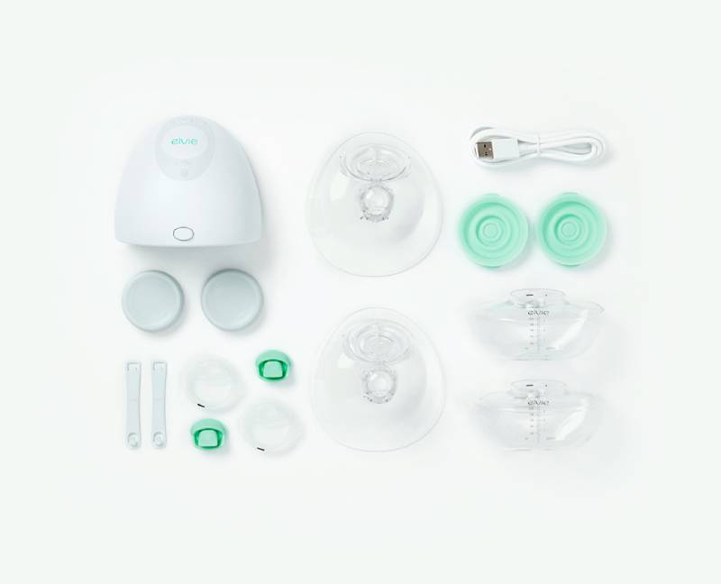 Elvie breast pump with pieces on white background