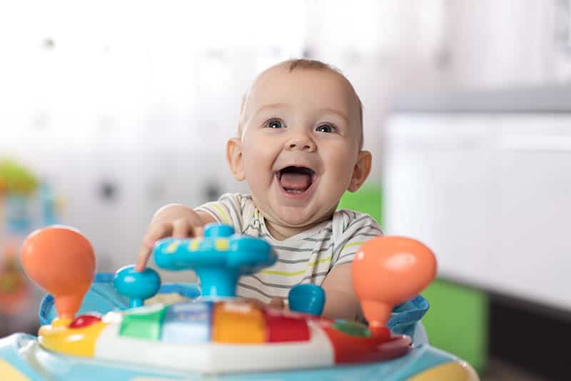 happy baby laugh in a baby jumper