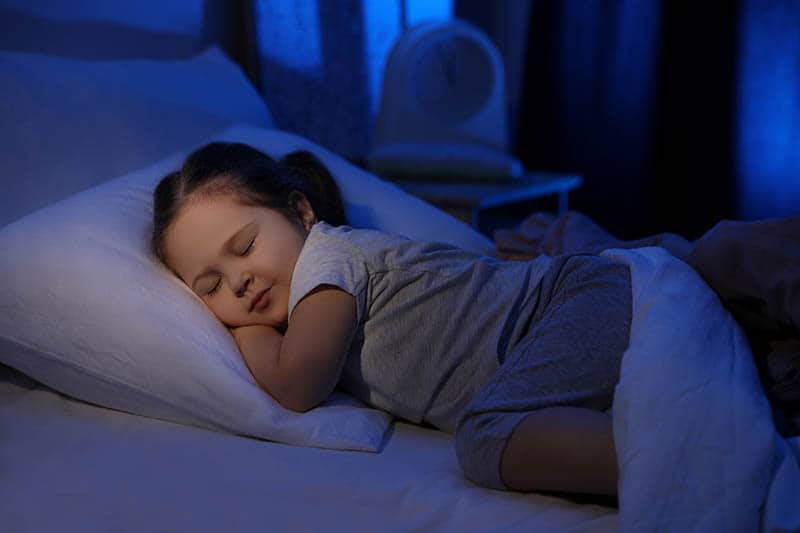 toddler girl sleeping on best pillow for toddlers