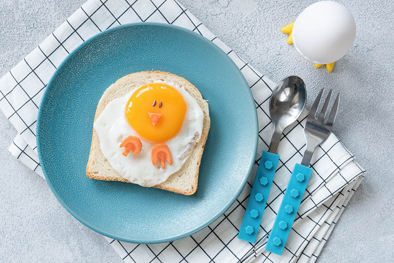 egg on a toast with a face on it