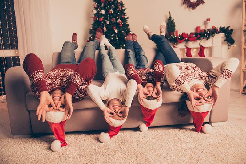 happy family at christmas goofing around telling christmas jokes for kids