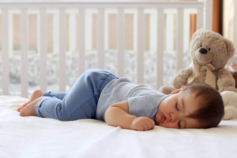 cute baby sleeping on the bed