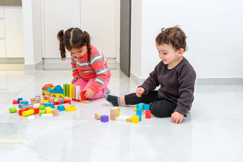 kids playing with toys on the floor