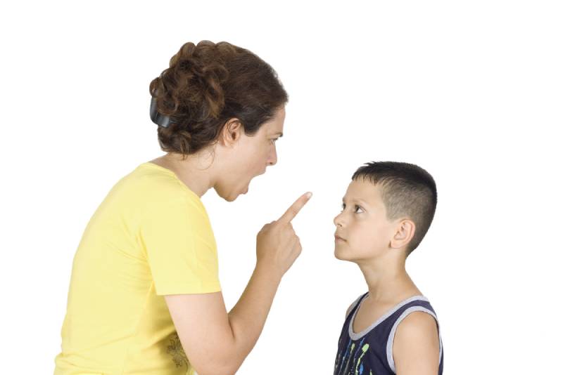 Boy confronts his mother while she yells at him on white background