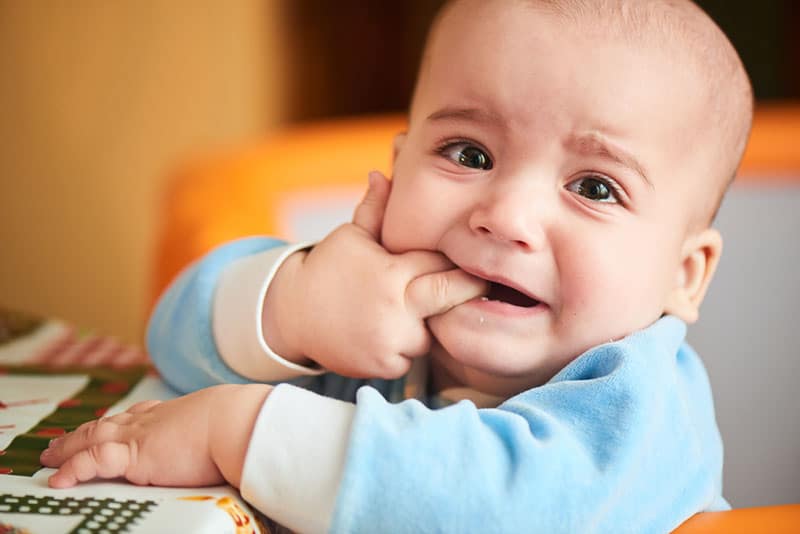 little baby crying beacuse of teeth growing