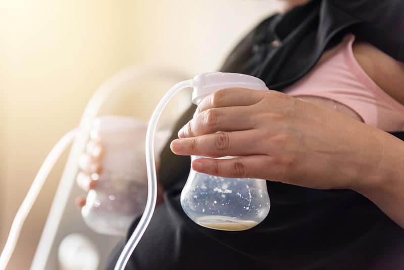 woman pumping her breast milk
