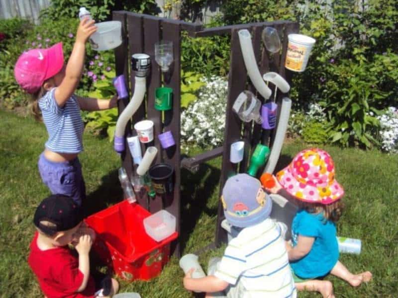 Kids playing outdoors and making water wall