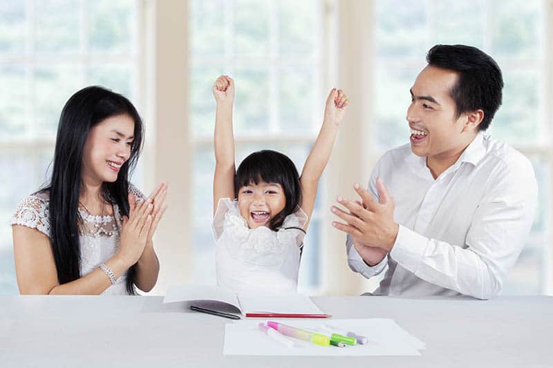 asian parents motivating their daughter 