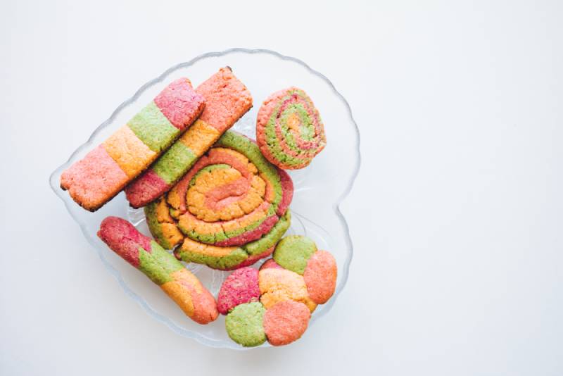 unicorn rainbow cookies on a glass plate 