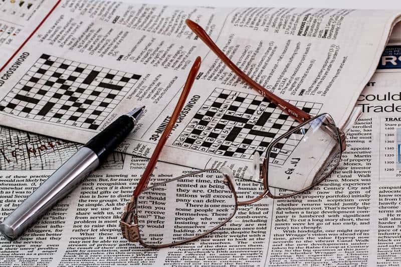 newspapers with glasses on them