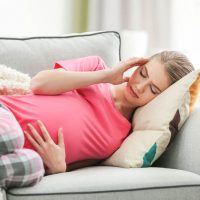 pregnant woman having migraine