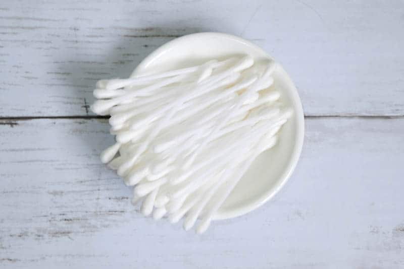 cotton swabs on a small white plate