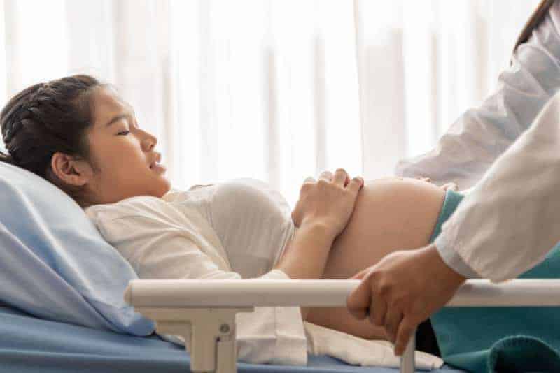 pregnant woman lying in hospital 