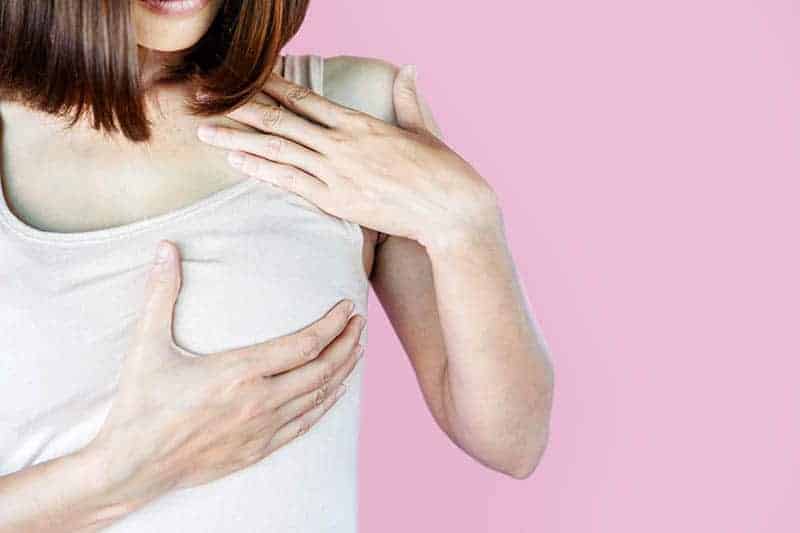 woman holding for painful breast