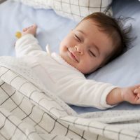cute baby smiling in sleep