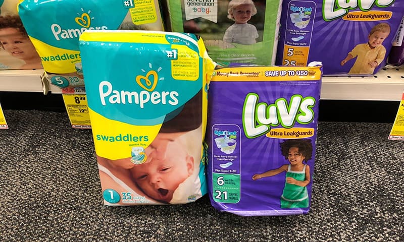 package of pampers and luvs baby diapers in store
