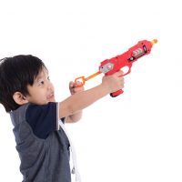 cute little boy playing with nerf gun