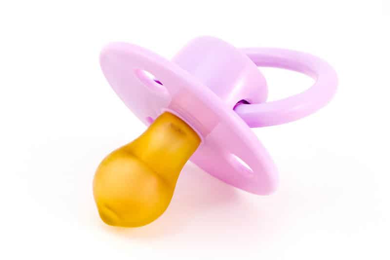 pink pacifier for babies with silicone yellow nipple