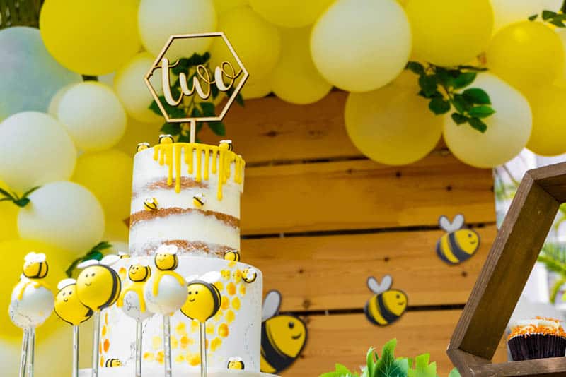 bee themed shower party for baby with big cake