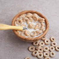 bowl full of milk and honey nut cheerios on the table