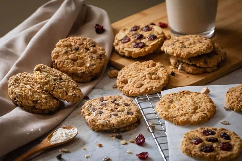 delicious lactation cookies with raisins and a glass of milk on the table