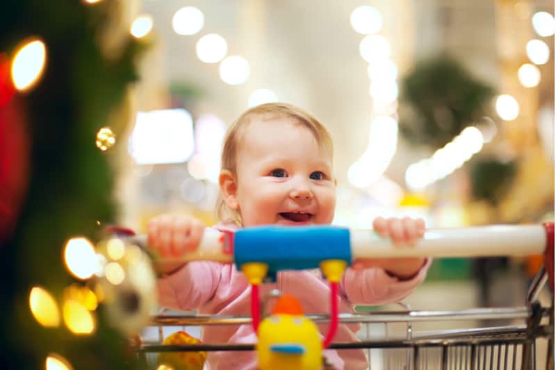 Beautiful baby girl in shopping